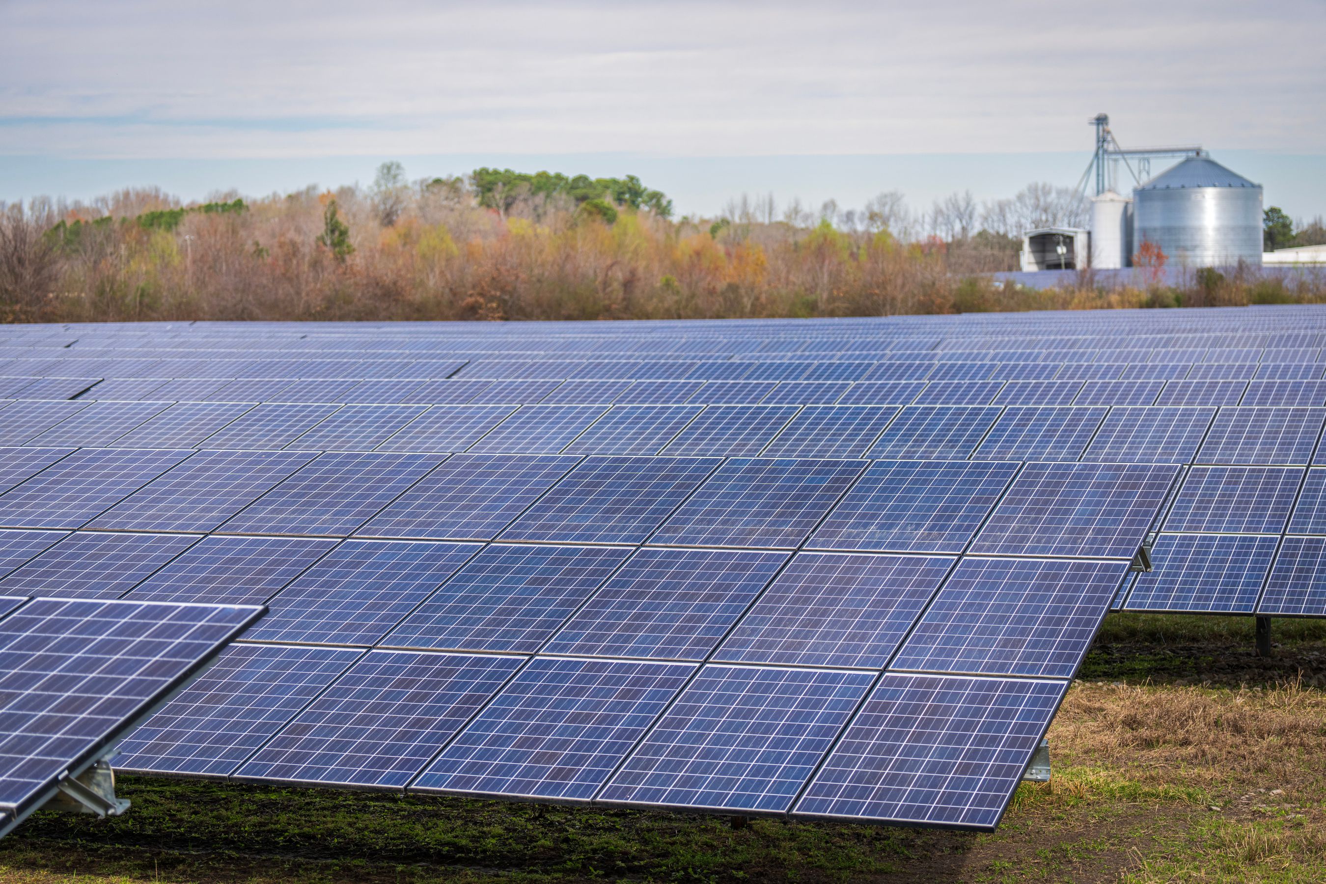 Large field of photovoltaic solar panels under a clear sky